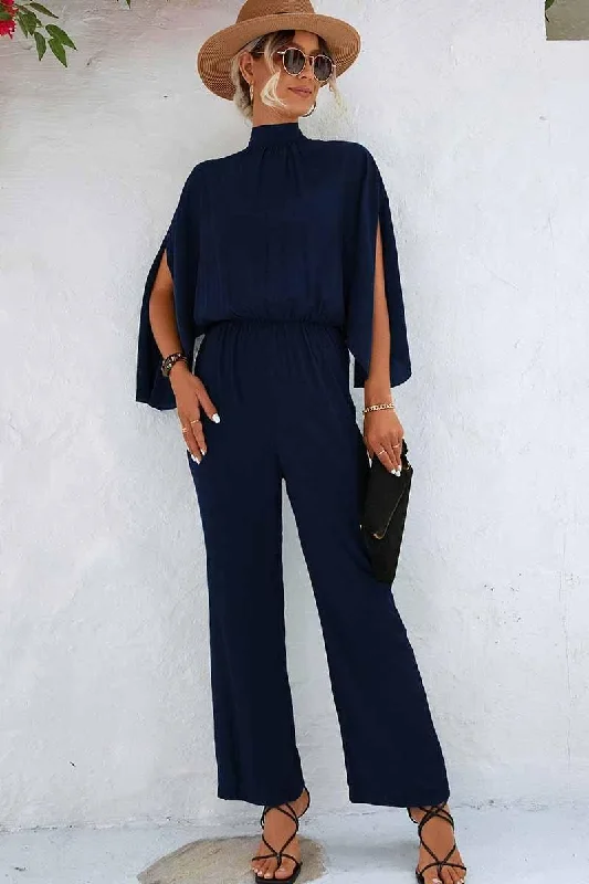 HIGH NECK SLIT BACK CAPE SLEEVE JUMPSUIT